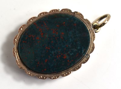 Lot 214 - A yellow metal agate and carnelian locket...