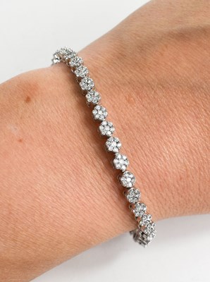 Lot 178 - An 18ct white gold and diamond tennis bracelet,...