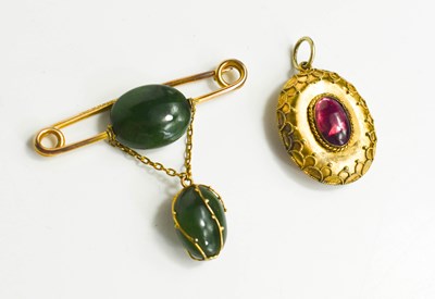 Lot 341 - A 9ct gold and jade brooch, the gold pin...