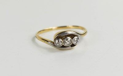 Lot 31 - A 9ct gold and diamond three stone ring, size...