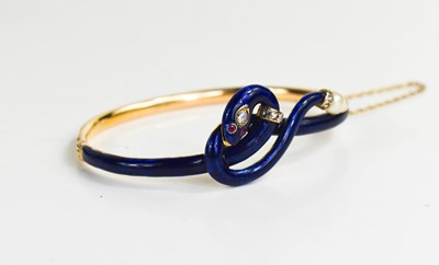 Lot 9 - A late 19th century gold, diamond, blue enamel...