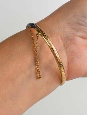 Lot 9 - A late 19th century gold, diamond, blue enamel...