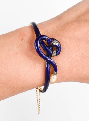 Lot 9 - A late 19th century gold, diamond, blue enamel...