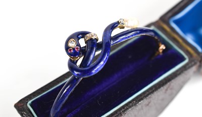 Lot 9 - A late 19th century gold, diamond, blue enamel...