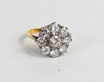 Lot 101 - An 18ct gold and diamond ring, the central...