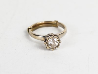 Lot 259 - An 18ct gold and diamond solitaire ring, in an...