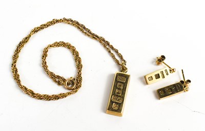 Lot 11 - A 9ct gold ingot pendant necklace with...