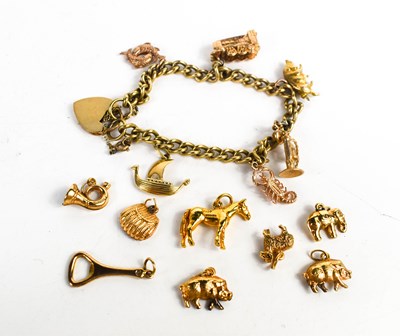 Lot 243 - A 9ct gold charm bracelet,with a heart form...