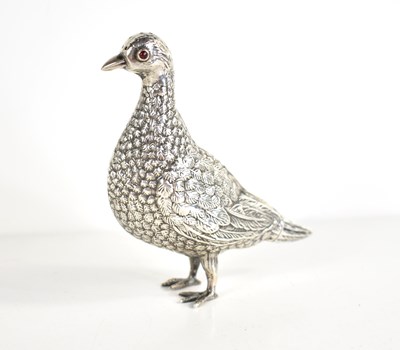 Lot 50 - A silver pepper pot in the form of a partridge...