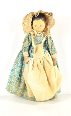 Lot 345 - An early 20th century wooden peg doll with...