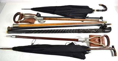 Lot 301 - A group of walking canes, parasols and...