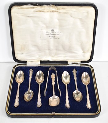 Lot 21 - A cased set of six silver tea spoons, sugar...