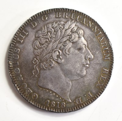 Lot 104 - A George III silver crown dated 1818, the edge...