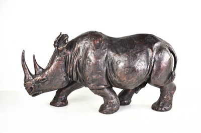 Lot 260 - A bronzed resin rhinoceros sculpture in the...