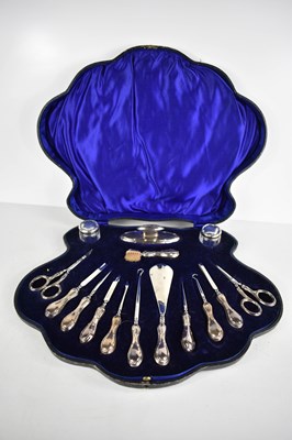 Lot 59 - A silver manicure set, comprising nail buff,...