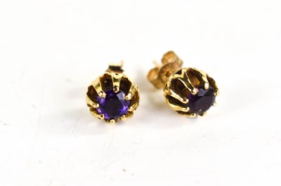 Lot 143 - A pair of 9ct gold and amethyst stud earrings,...