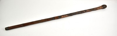 Lot 314 - A Japanese bamboo cane carved with warriors, 88cm