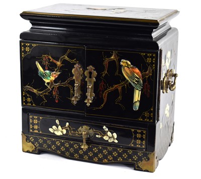 Lot 255 - A Chinese black lacquered two door cabinet...