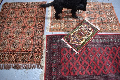 Lot 453 - A group of three Middle Eastern wool rugs,...