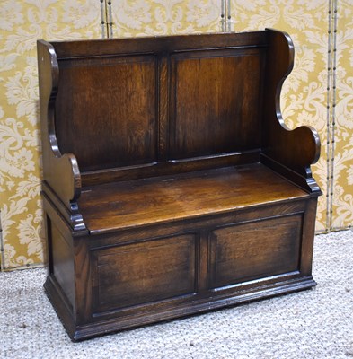 Lot 474 - A 20th century oak box settle in the old...