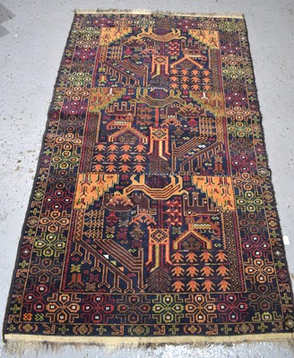 Lot 455 - A Middle Eastern pictorial wool rug, blue...