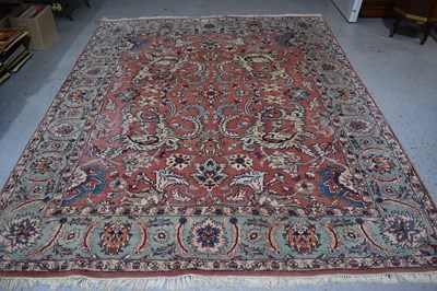 Lot 454 - A large Oriental wool rug, pink ground...