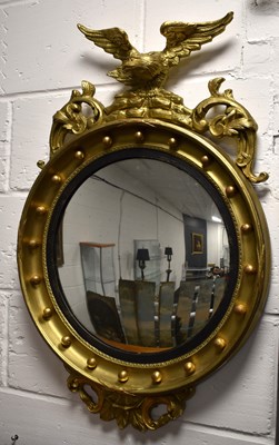 Lot 375 - A Regency-style convex giltwood mirror, the...