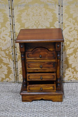 Lot 458 - A small hardwood bedside cabinet with four...