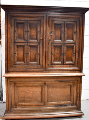 Lot 505 - A large 18th century oak cupboard, the top...