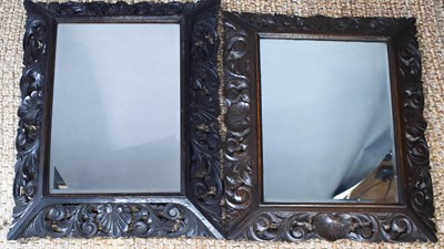 Lot 459 - Two similar carved mirrors of rectangular form,...