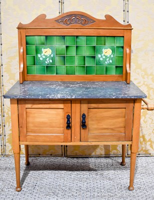 Lot 465 - An early 20th century pine washstand with...