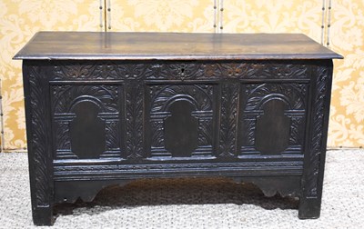 Lot 504 - A 17th century oak coffer, the plank top above...