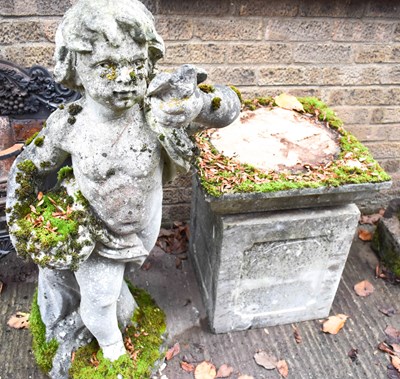 Lot 501 - An antique stone garden statue, cherub holding...