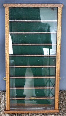 Lot 462 - An oak wall display cabinet with eight shelves,...