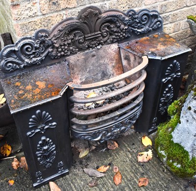 Lot 483 - A Victorian cast iron fire grate, cast with...