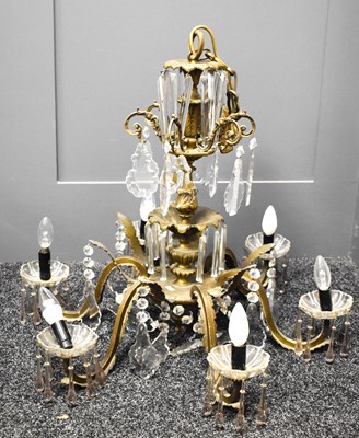 Lot 371 - A six branch vintage brass chandelier, with...