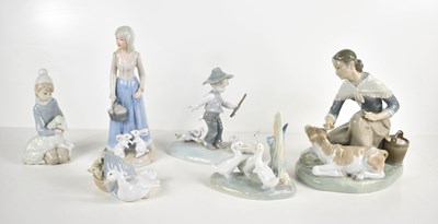 Lot 200 - A group of porcelain to include three Lladro...