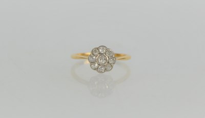 Lot 71 - An 18ct gold and diamond daisy head ring, the...