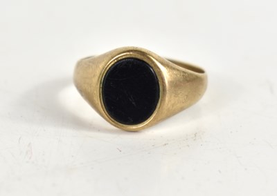 Lot 97 - A 9ct gold signet ring set with a black onyx...