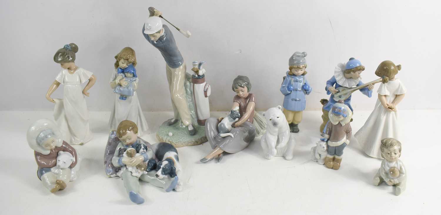Lot 231 - A group of four Lladro figurines including...