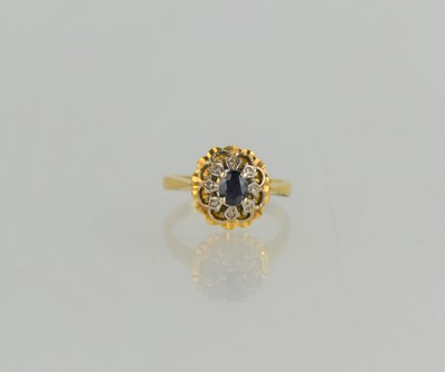 Lot 174 - An 18ct gold, sapphire and diamond ring of...