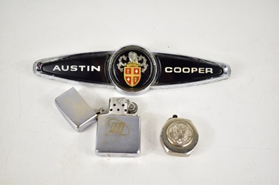 Lot 130 - A vintage Zippo lighter together with a US...