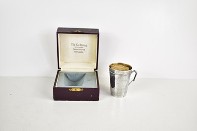 Lot 88 - An Indonesian white metal Christening mug in...