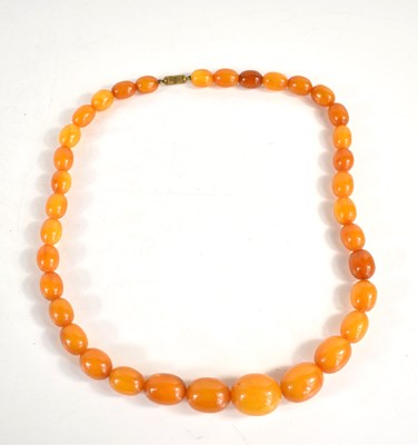 Lot 334 - A vintage butterscotch amber graduated beaded...