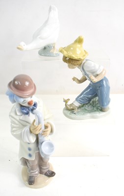 Lot 226 - Three Nao figurines, to include a goose, boy...