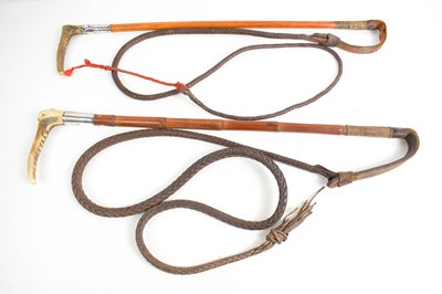 Lot 342 - Two antique horse whips, both with silver...