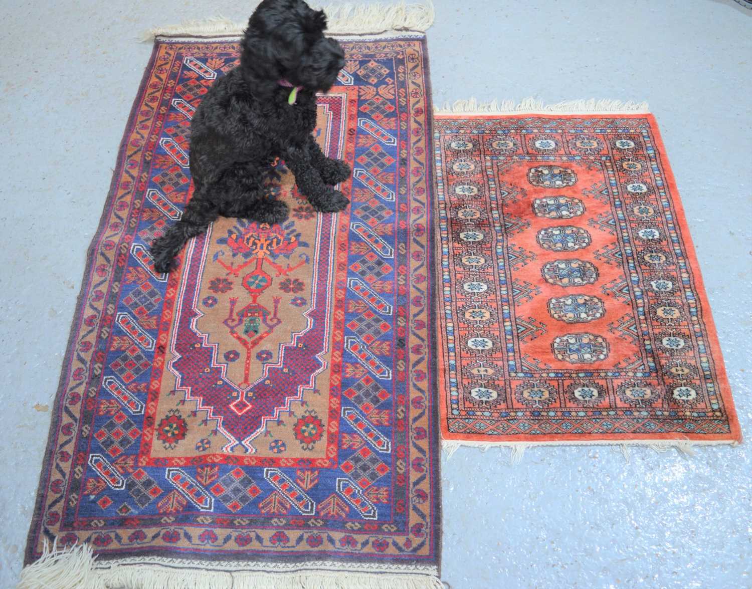 Lot 482 - A Tekke type rug with red ground together with...