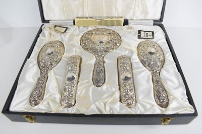 Lot 101 - A silver dressing table set, comprising hand...