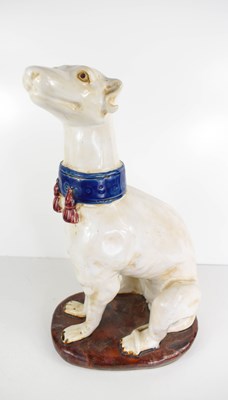 Lot 230 - A 20th century glazed pottery white greyhound...