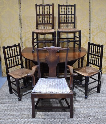 Lot 411 - An 18th century oak drop leaf table, the...